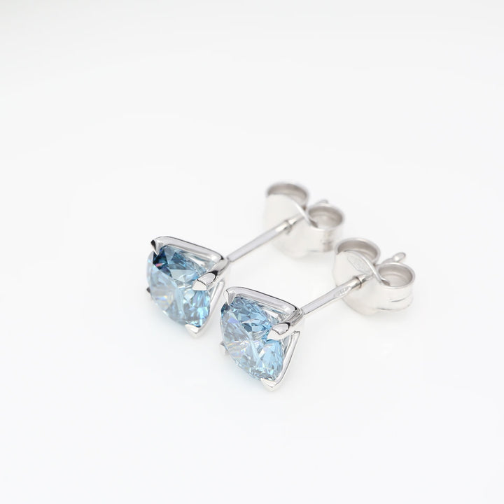 Customizable 4-Prong Round Brilliant Diamond Earrings – White or Fancy Color (Pink, Blue, Green)